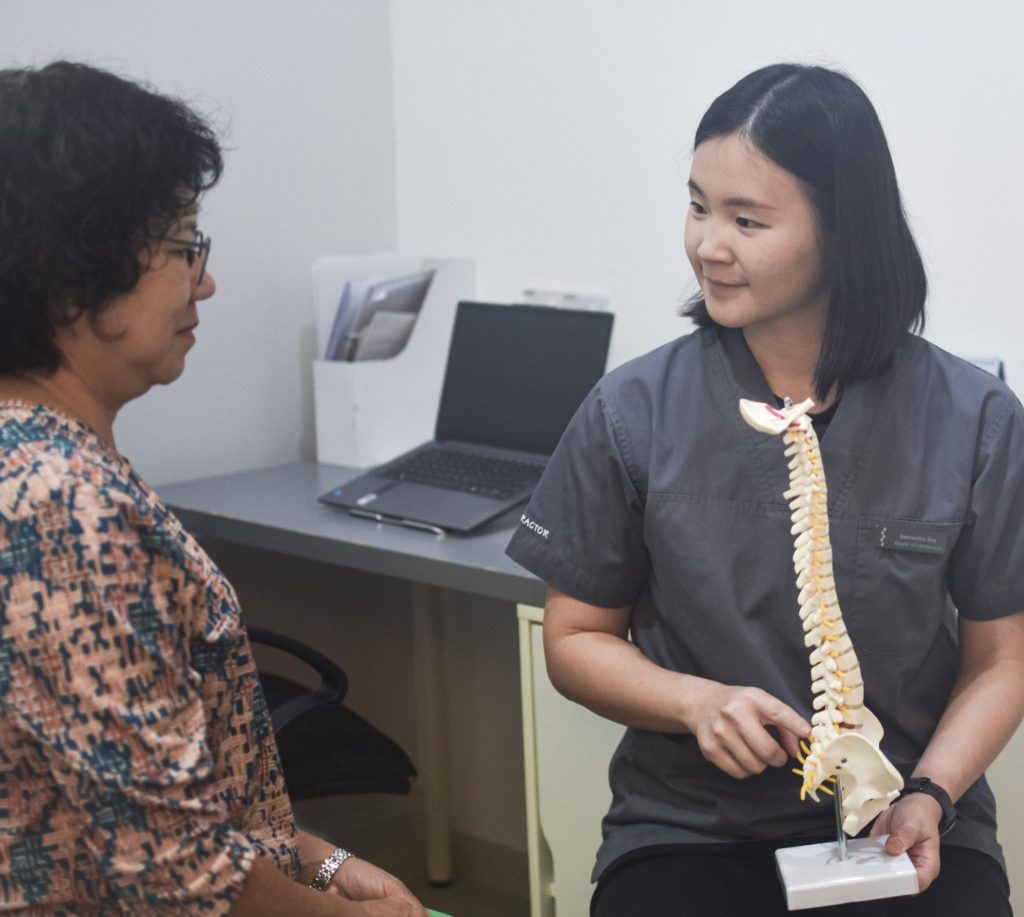 A chiropractor is explaining the diagnostic